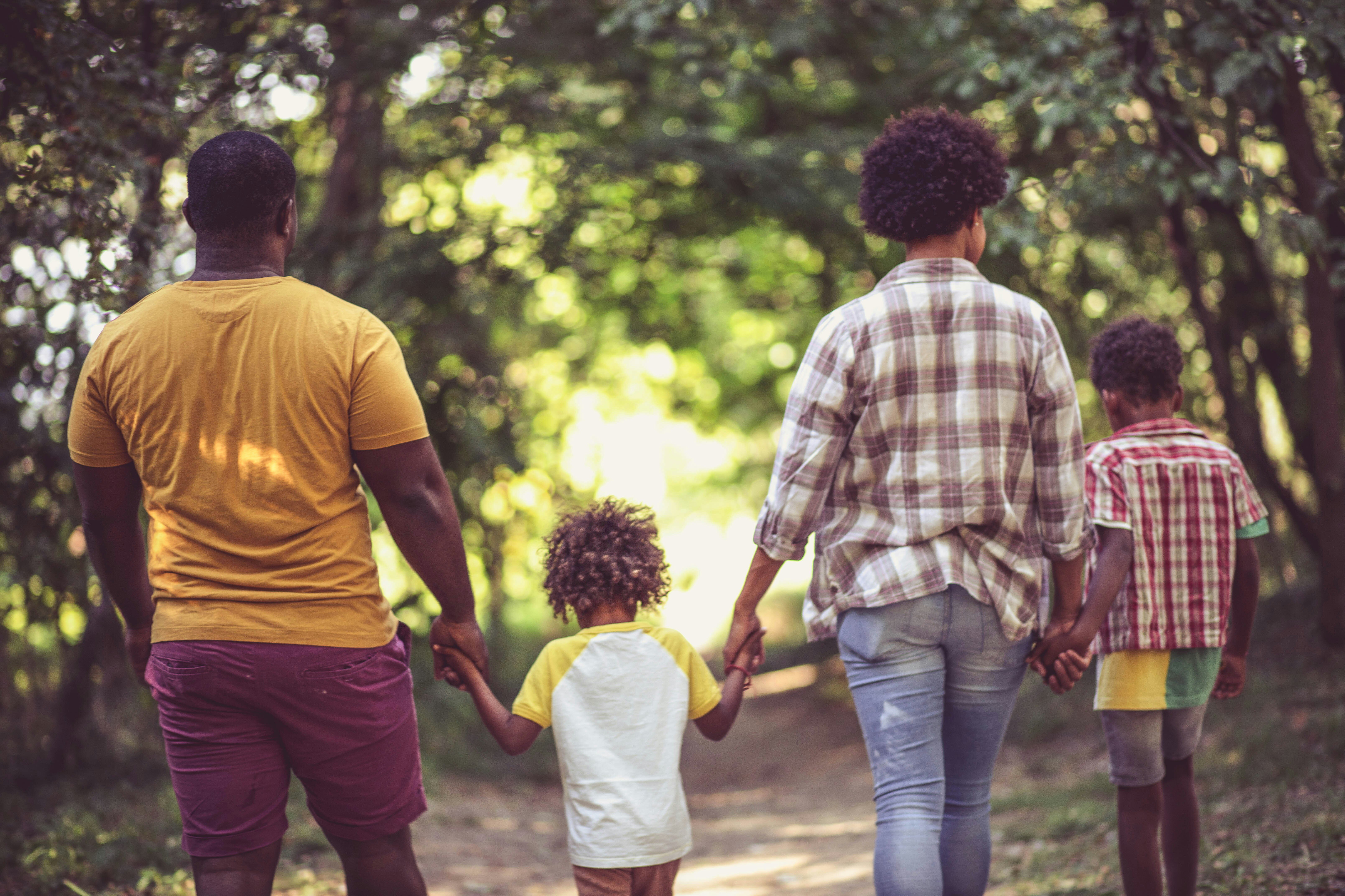 family-walking-holding-hands