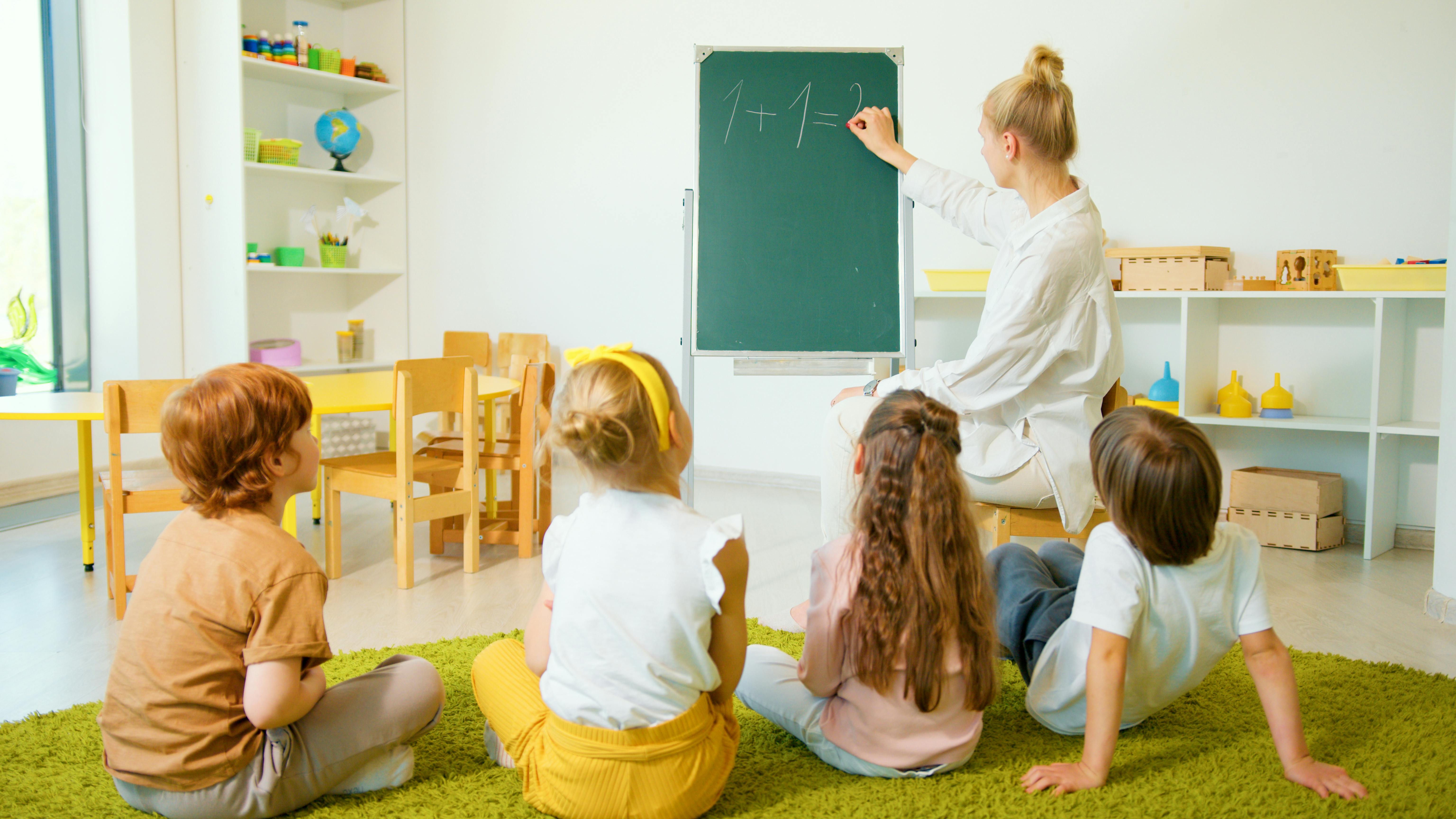 preschool-teacher-with-children